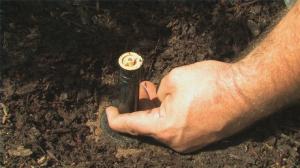 San Carlos CA sprinkler repair contractor adjusts a pop up sprinkler head